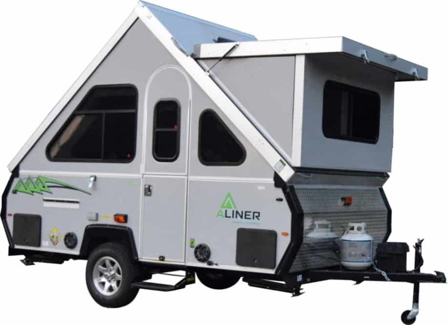 A small camper trailer with a slide out.