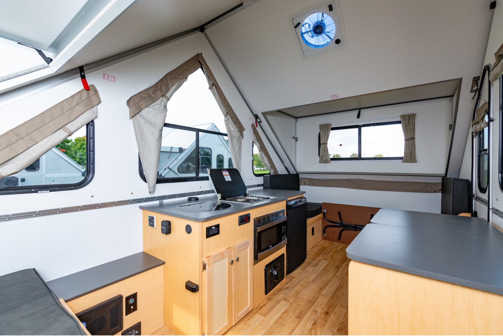 The interior of an rv with a kitchen and living area.