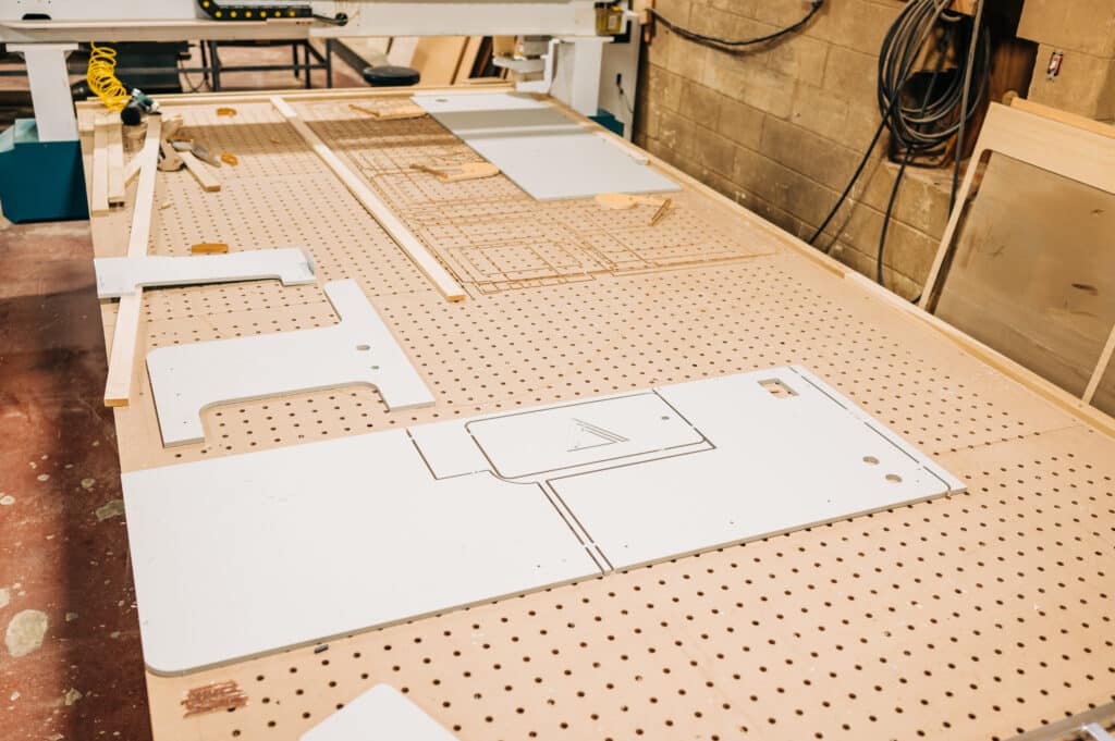 A table with many pieces of wood on it