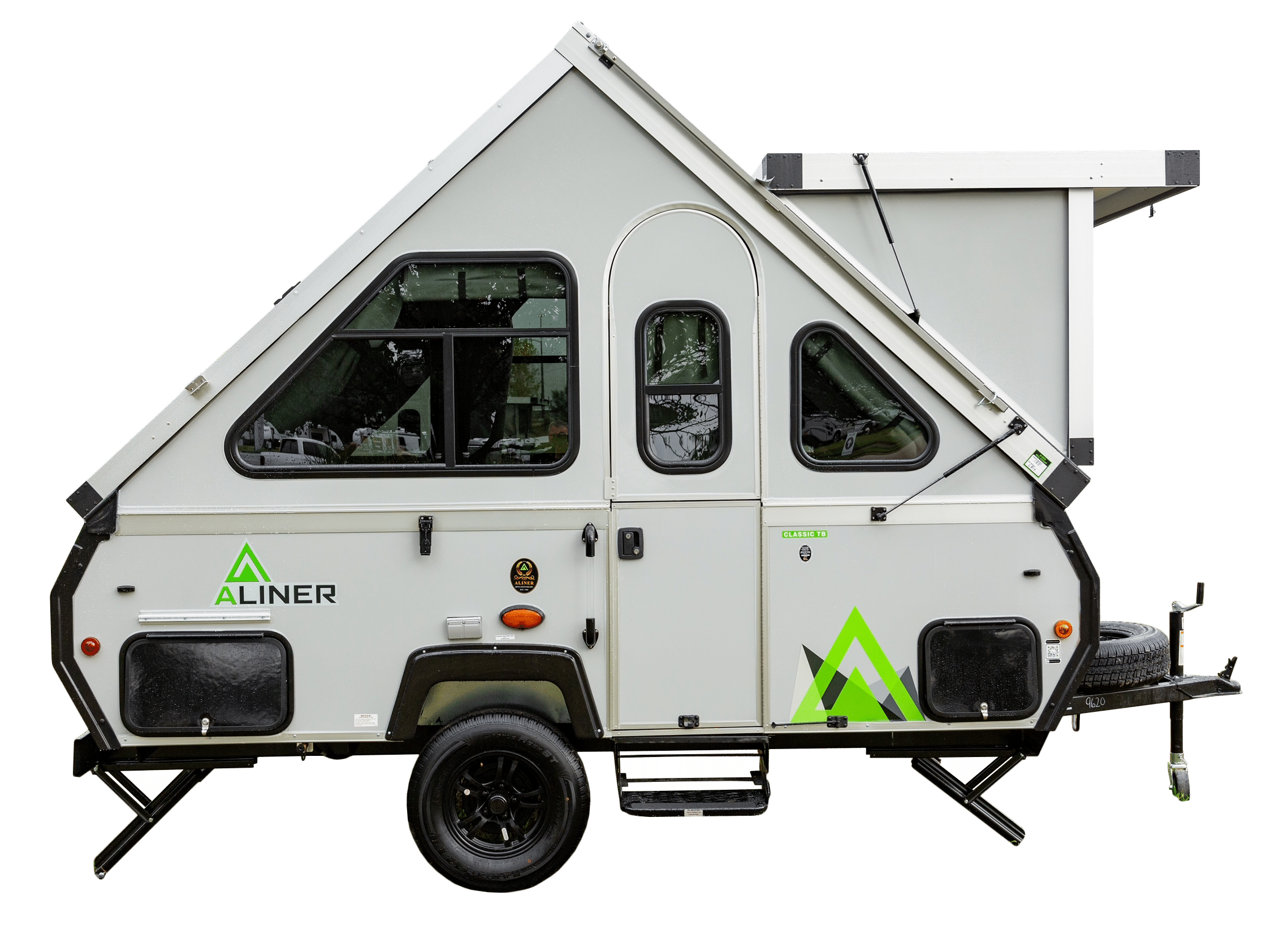 A camper trailer with a green and white design.